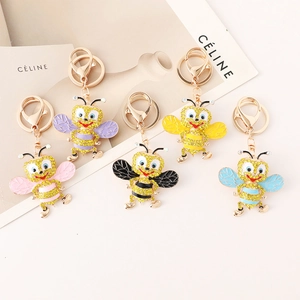 Creative rhinestone bee keychain set featuring five vibrant colors and golden hardware