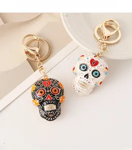 Detailed close-up of colorful enamel sugar skull keychains with intricate floral patterns