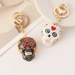 Colorful Mexican Day of the Dead mandala skull keychains in black and white enamel