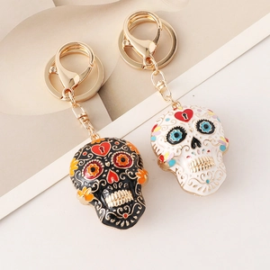 Mandala skull enamel keychains in black and white with colorful floral patterns