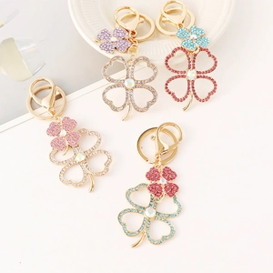 Elegant four-leaf clover crystal keychains with colorful rhinestones on gold alloy finish