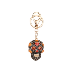 Sugar skull keychain with orange flowers and gold accents for Day of the Dead bags