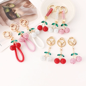 Porte-clés Cerise en Strass Mignon pour Femmes Pendentif de Sac en Fruits en Alliage de Zinc avec Cordon en Cuir Tressé