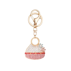 Creative handbag keychain with sparkling rhinestones and floral charms on gold metal ring