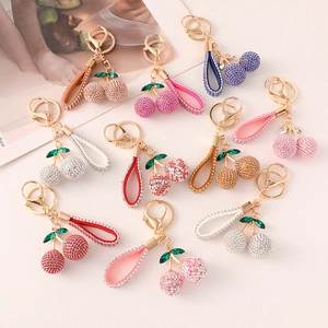 Colorful cherry keychain with rhinestones in various colors and golden snap hook