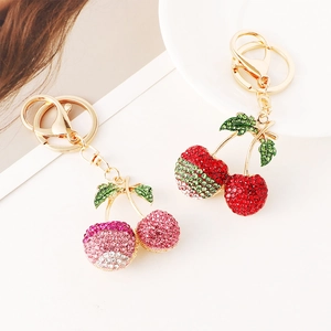 Sparkling cherry rhinestone keychain with gold alloy finish in pink and red colors