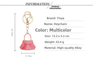 Pink rhinestone handbag keychain with dimensions 12.2x5.2cm on a white background