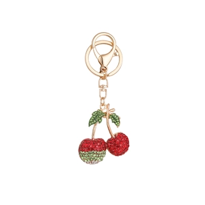 Sparkling cherry keychain with red and green rhinestones on golden alloy base