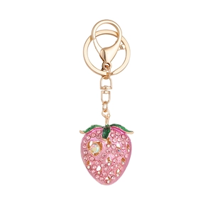 Cute pink strawberry keychain with sparkling rhinestones and golden metal hardware