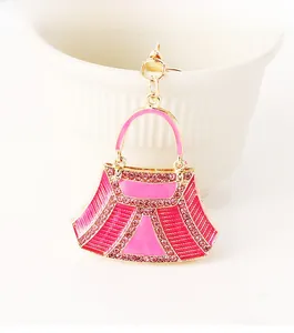Detailed close-up of pink rhinestone handbag keychain with gold-plated metal finish