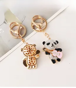 Detailed close-up of a panda keychain with rhinestones and hollow heart pattern back