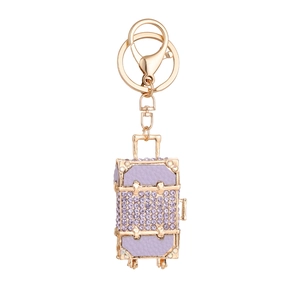 Exquisite purple leather suitcase keychain with rhinestones and golden metal accents