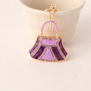 Exquisite purple handbag keychain with sparkling rhinestones and gold plating