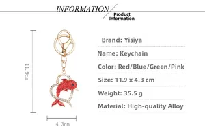 Detailed size and weight specs for the golden dolphin keychain with red rhinestones