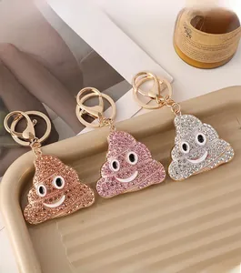 Porte-clés émoticône caca sertis de strass brillants en or, rose et argenté