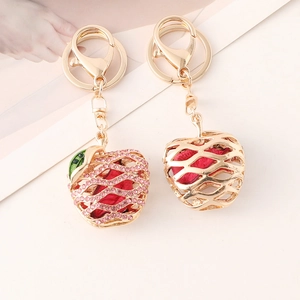 Exquisite hollow apple keychains with pink rhinestones and red flower fill on gold alloy