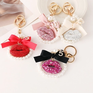 Fashionable rhinestone lip keychains with ribbon bows and pearls in four colors