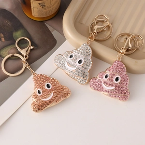 Lot de trois porte-clés en métal en forme de crotte avec strass rose, argent et doré