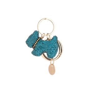 Sparkling blue crystal Scottie dog keychain in gold alloy finish on white background
