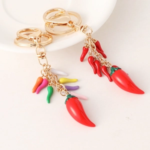 Creative handmade red chili keychain with colorful mini pendants and golden metal ring