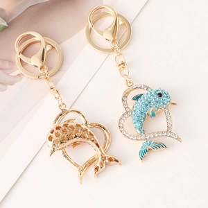 Sparkling crystal heart dolphin keychains with gold plating and blue rhinestones
