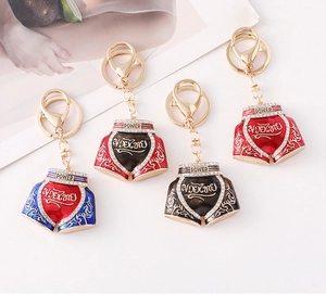 Detail of Muay Thai shorts keychains with enamel finish and sparkling crystal accents
