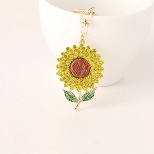 Sparkling sunflower keychain with colorful rhinestones on a gold base for car keys