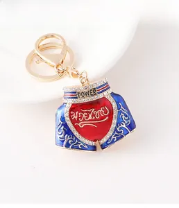Macro view of Muay Thai shorts keychain with rhinestones and engraved Power lettering