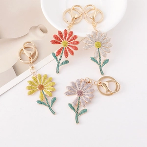 Sparkling daisy flower rhinestone keychains in vibrant colors with gold metal clasps