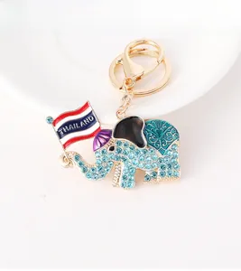 Detail of Thai elephant keychain with blue rhinestones and Thailand flag ornament
