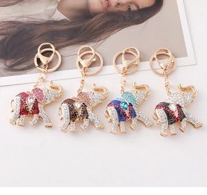 Detail view of crystal elephant keychains in four colors with gold lobster clasps