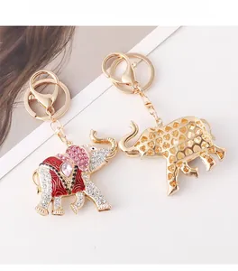 Detail of colorful crystal elephant keychain with pink gems and gold heart hollow design