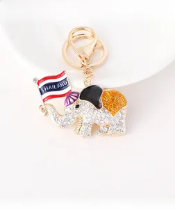 Macro view of crystal encrusted elephant keychain featuring Thailand flag detail