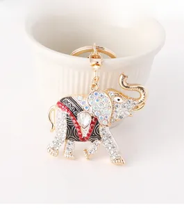 Detailed macro shot of an elephant keychain with white rhinestones and enamel accents