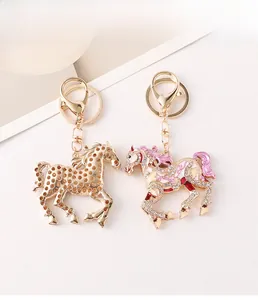 Detail of colorful enamel horse keychain with sparkling crystals and golden lobster clasp