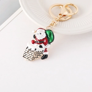 Christmas Santa Claus climbing chimney keychain with red enamel finish and gold ring