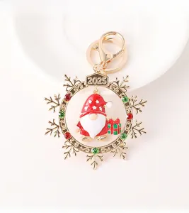 Detailed close-up of 2025 Christmas snowflake keychain with red Santa gnome and rhinestones