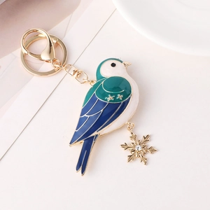Anhänger Vogel Schlüsselanhänger mit bunter Emaille und funkelnder Schneeflocke