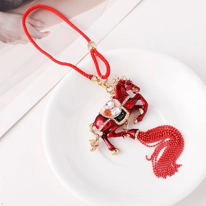 Chinese red enamel horse charm with colorful rhinestones and beaded tassel ornament