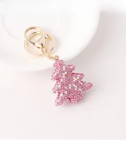 Detailed view of pink rhinestone Christmas tree keychain with gold lobster clasp