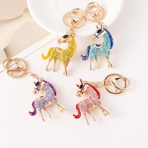 Colorful crystal encrusted flying horse car keychain set in gold-tone metal alloy