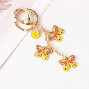 Modischer goldener Schmetterling Schlüsselanhänger mit orangefarbenen Emaille-Anhängern