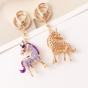Sparkling crystal unicorn and golden giraffe keychain charms for handbags and car keys