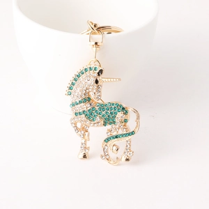 Porte-clés licorne de dessin animé avec strass blancs et verts sur métal doré