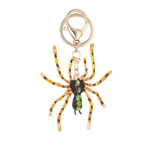 Porte-clés grande araignée exagérée avec cristaux verts et finition métal émaillé orange