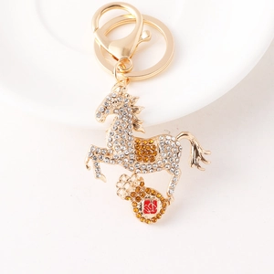 Creative gold horse keychain with sparkling rhinestones and a lucky red pendant charm