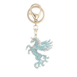 Porte-clés licorne pégase doré orné de strass bleu clair sur un fond blanc épuré