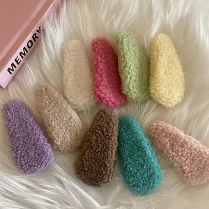 Set of nine colorful cream puff plush hair clips in candy colors with sherpa wool texture