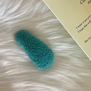 Chic turquoise plush cream puff hair clip in soft lamb wool for elegant side styling
