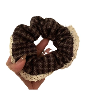 Vintage dark plaid scrunchie with cream lace trim for elegant autumn hair styling